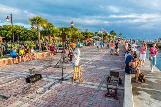 Key West, USA - August 26, 2014: people enjoy the sunset point at Mallory square in Key West, USA. This place is the most popular sunset point in Key West.
