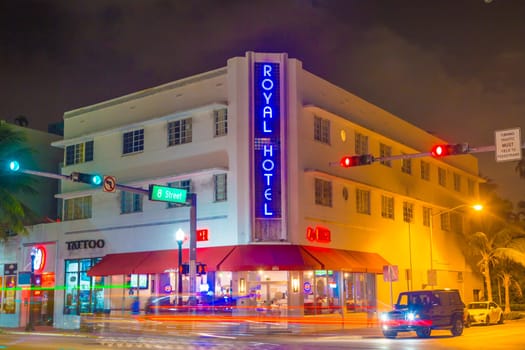 Miami, USA - August 30, 2014: night view to ocean drive with art deco hotels and buildings.
