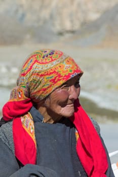 Leh, India - September 18, 2014: portrait of sitting local woman in traditional costume near Leh in province Ladakh in India.