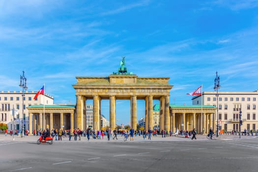 Berlin, Germany - October 27, 2014: view to Brandenburger gate in early morning with normal traffic at the street.