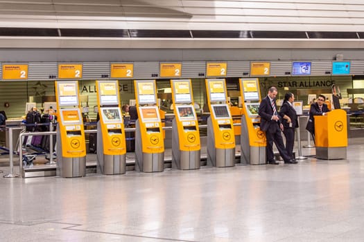 FRANKFURT, GERMANY - SEP 22, 2014: people at the Airport in the evening in Frankfurt, Germany. In 2012, Frankfurt handled 57.5 million passengers.