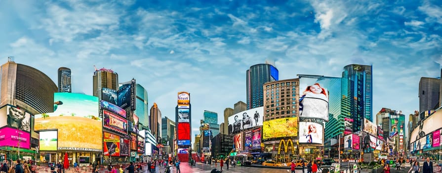 NEW YORK, USA - OCT 21, 2015: people visit Times Square, featured with Broadway Theaters and huge number of LED signs, is a symbol of New York City and the United States.