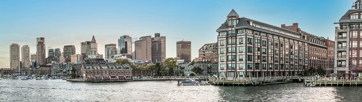 Boston, USA - September 29, 2017: view to  skyline of Boston with old and modern skyscraper and river with boats.