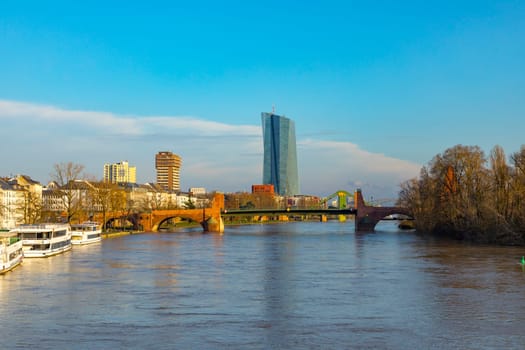 Frankfurt, Germany - January 9, 2018: view to skyline of Frankfurt with new building of European central Bank with river Main.