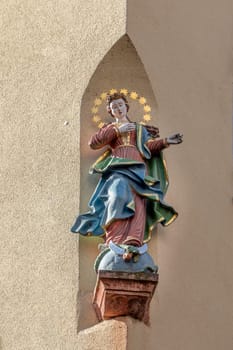 Miltenberg, Germany - April 6, 2018: Virgin Mary, statue on the main street of Miltenberg in Lower Franconia, Bavaria, Germany.