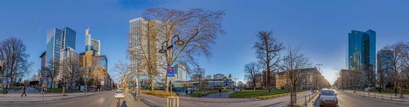 Frankfurt, Germany - Bebruary 27, 2018:  panorama perspective of skyscraper in the banking center of Frankfurt, Germany at Willy Brandt square.