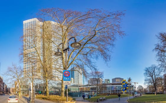 Frankfurt, Germany - February 27, 2018:  panorama perspective of skyscraper in the banking center of Frankfurt, Germany at Willy Brandt square.
