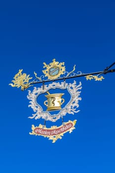Rothenburg ob der Tauber, Germany - April 6, 2018: sign for Marien Apotheke - engl. Mary Pharmacy at the wall of the old pharmacy in Rothenburg ob der Tauber.