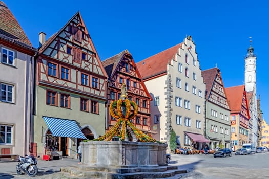 Rothenburg ob der Tauber, Germany - April 6, 2018: colorful easter decoration at a fountain in Rothenburg ob der Tauber.