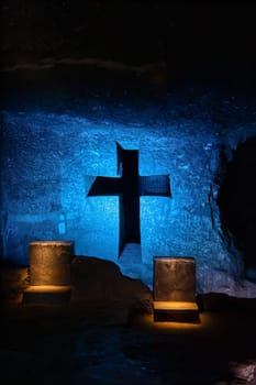 Illuminated cross representing stations of the cross, illustrate events of Jesus last journey, light in underground Catedral de Sal (Salt Cathedral) of Zipaquira, one of Colombian wonders, Colombia.