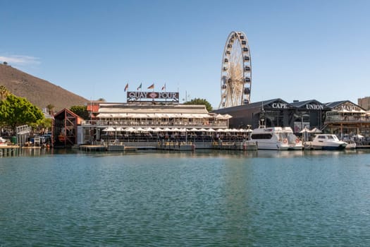 Cape Town, South Africa - April 16, 2018: big wheel as tourist attraction in the harbor of Cape Town, South Africa.