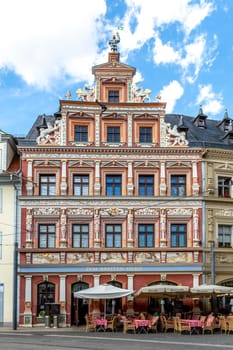 Erfurt, Germany - July 29, 2018: facade at house  ZUM BREITEN HERD  engl: House of wide oven at Fischmarkt, Erfurt, Thuringia, Germany, Europe