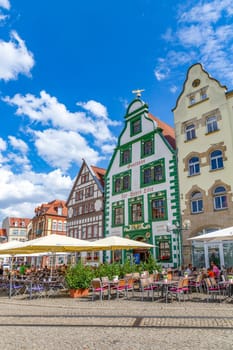 Erfurt, Germany - July 29, 2018: people at the central square in front of the cathedral at the city of Erfurt, Germany. Erfurt is the Capital of Thuringia and the city was first mentioned in 742.