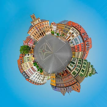 Weimar, Germany - July 28, 2018: panoramic view of old market place in Weimar in tiny planet format with famous city hall.