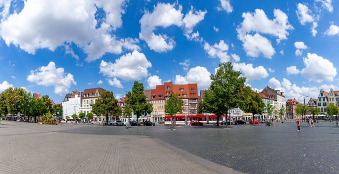 Erfurt, Germany - July 29, 2018: people at the central square in front of the cathedral at the city of Erfurt, Germany. Erfurt is the Capital of Thuringia and the city was first mentioned in 742.