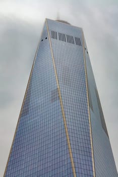 New York, USA - November 5, 2018: tower of  one world trade center in fog.