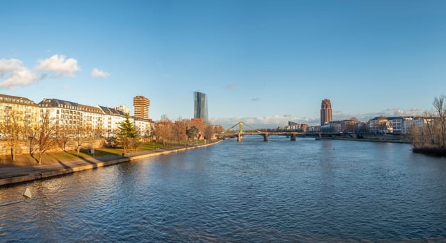 Frankfurt, Germany - January 14, 2019: skyline of Frankfurt am Main with ships on river Main.