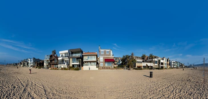 Manhattan Beach, USA - March 4, 2019: scenic beach houses at the promenade of Manhattan beach, USA near Los Angeles.