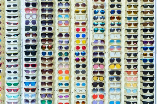 Venice, USA - March 5, 2019: sunglasses in a rack in different colors sold at beach promenade in Venice Beach.