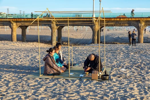 Los Angeles, USA - March 4, 2019: tea ceremony by a japanese monk at the beach in Redondo Bay in Los Angeles, USA.