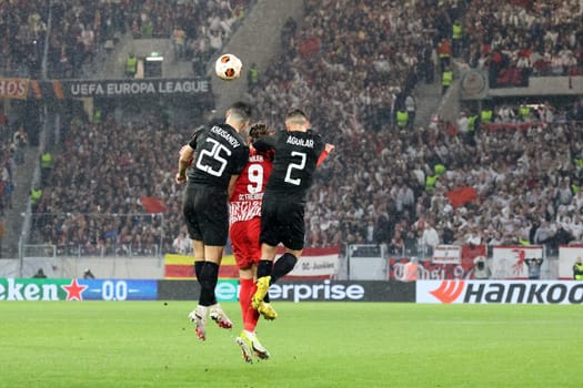 Well shaded: Abduqodir Khusanov (RC Lens) and Ruben Aguilar (RC Lens) give Lucas Höler (SC Freiburg) no chance with a header in the match of the Football Europa League - Qualification 1/8 Final,SC Freiburg vs RC Lens