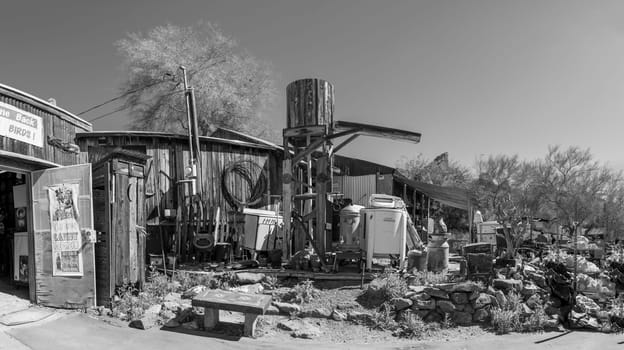 Oatman Ghost Town,   USA - March 3 , 2019:  view of the the famous living ghost town along historical Route 66. garbage is stapled at the house wall.