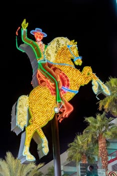 Las Vegas, USA - March 9, 2019: view to cowboy Vic in the Fremont street by night, illuminated by light bulbs in Las Vegas, USA.