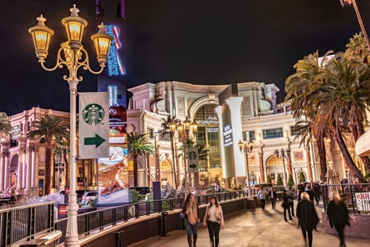 Las Vegas,  USA - March 3, 2019: Neon lights at the shoppingt mall the Forum and Hotel and Casino at the Las Vegas Strip at nigh.