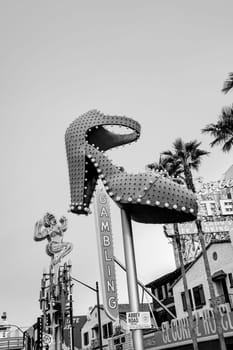 Las Vegas, USA - March 9, 2019: Close up of the famous Ruby Slipper neon sign, downtown Las Vegas, near the Fremont Street Experience. Las Vegas is known for its historical neon signs.