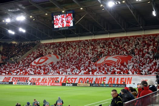 Successful choreography: The South Stand in red and white as the 12th man for the team at the match of the Football Europa League - Qualification 1/8 Final,SC Freiburg vs RC Lens
