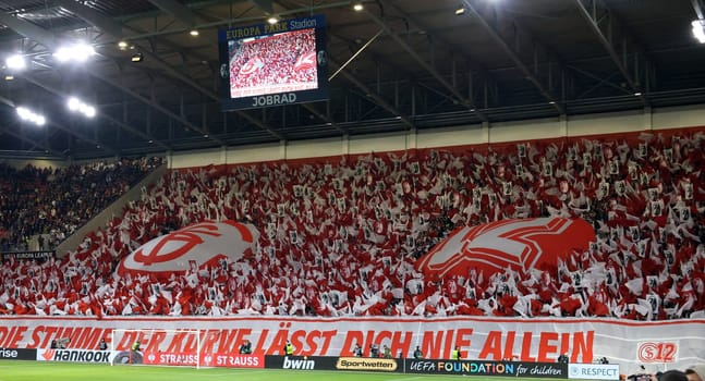 Successful choreography: The South Stand in red and white as the 12th man for the team at the match of the Football Europa League - Qualification 1/8 Final,SC Freiburg vs RC Lens