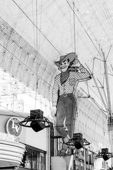 Las Vegas, USA - March 10, 2019: The Las Vegas Vic cowboy neon at the former Pioneer Casino in Las Vegas Fremont street. The classic sign was built in 1951.