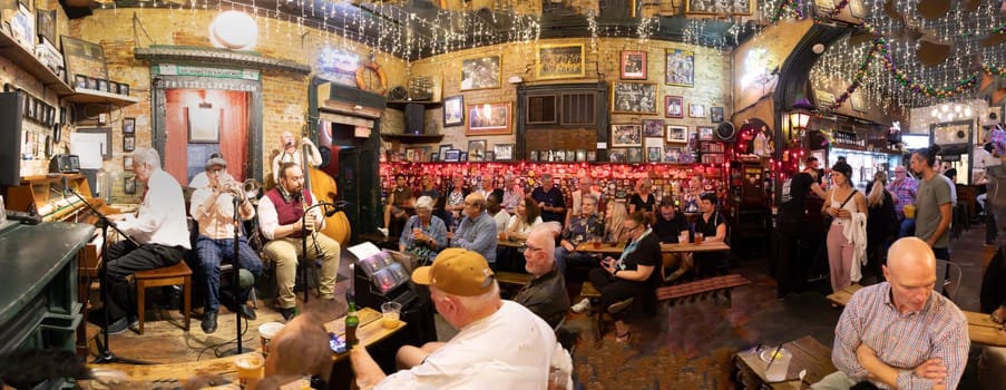 New Orleans  USA - October 25, 2023: listening to a band in the Jax club Frittzels at the Buorbon street on New Orleans by night.