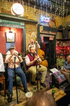 New Orleans  USA - October 25, 2023: listening to a band in the Jax club Frittzels at the Buorbon street on New Orleans by night.
