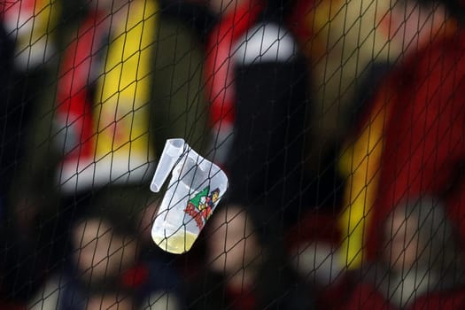 Projectiles,such as a beer cup that got caught in the safety fence,are the sad everyday life in professional football,like here at the match of the Football Europa League - Qualification 1/8 Final,SC Freiburg vs RC Lens