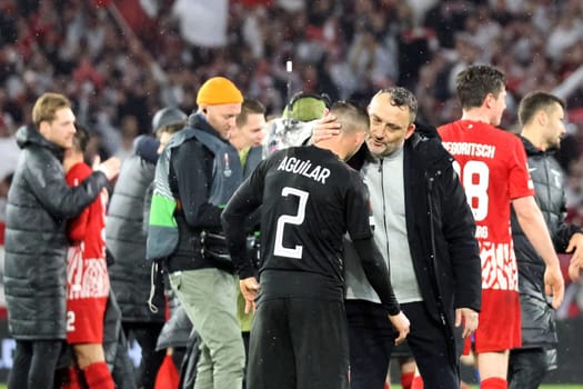 While the Freiburg players celebrate their entry into the round of 16,coach / coach Franck Haise (RC Lens) consoles his player Ruben Aguilar (RC Lens) after the 2:3 in the match of the Football Europa League - Qualification 1/8 Final,SC Freiburg vs RC Lens