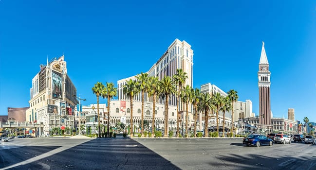 Las Vegas, USA - May 24, 2022: view to hotels and casinos at the Strip in daytime with neon advertising.