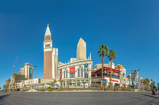 Las Vegas, USA - May 24, 2022: view to hotels and casinos at the Strip in daytime with neon advertising.