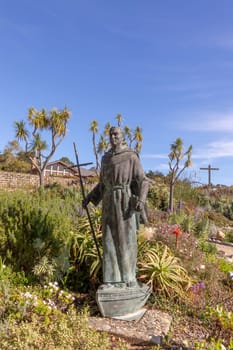 Carmel, USA - March 15, 2019: Bronze Statue of Saint Father Junipero Serra in the Gardens of the Carmel Mission Basiclia in Carmel, California , USA.