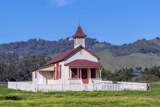 San Simeon, USA - March 15, 2019:  Located just off Highway 1, and in the shadow of Hearst Castle, this restored schoolhouse has been standing since 1903.