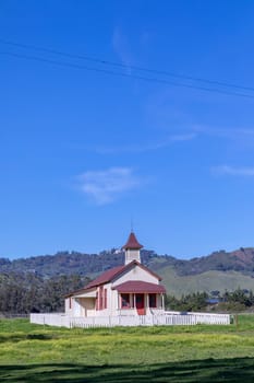 San Simeon, USA - March 15, 2019:  Located just off Highway 1, and in the shadow of Hearst Castle, this restored schoolhouse has been standing since 1903.