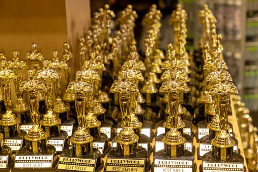 Los Angeles, USA - March 17, 2019: small Oscars in artifical gold for tourists in a souvenir shop.
