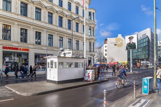 Berlin, Germany - March 25, 2019: Checkpoint Charlie in Berlin, Germany. The best-known Berlin Wall crossing point between East and West Berlin during the Cold War.