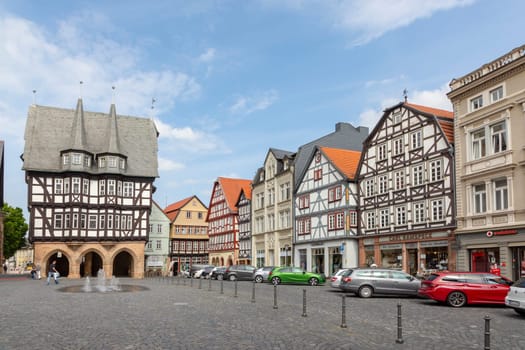 Alsfeld, Germany - June 25, 2021: famous town hall and half timbered historic houses at central square in Alsfeld, germany.