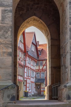 Alsfeld, Germany - June 25, 2021: famous town hall and half timbered historic houses at central square in Alsfeld, germany.