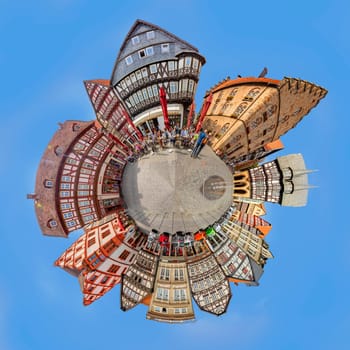 Alsfeld, Germany - June 25, 2021: famous town hall and half timbered historic houses at central square in Alsfeld, germany.