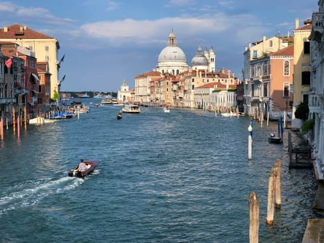 Venice, Italy - July 1, 2021: view to canale grande from bridge Academia in afternoon sun in Venice, Italy.