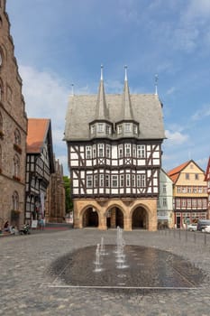 Alsfeld, Germany - June 25, 2021: famous town hall and half timbered historic houses at central square in Alsfeld, germany.