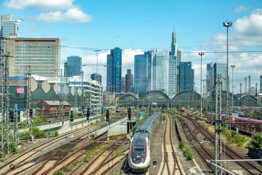 Frankfurt, Germany - June 21, 2021: entrance of Frankfurt central train station with skyline in background