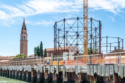 Venice, Italy - July 1, 2021: ferry station Venier, view to empty gas tanks in Venice, Italy.